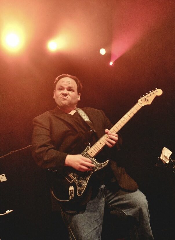 Chuck Credo IV under stage lights