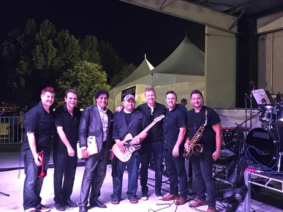 The band on stage at a festival